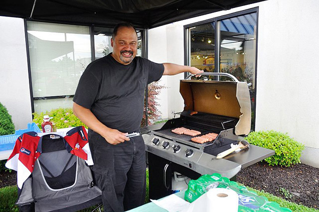 john grilling hot dogs