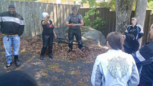 Lady Kim 

showing the way to the lake for baptizing as John shares the word